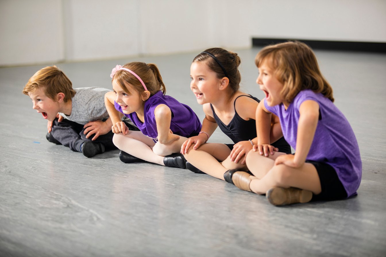 Children practicing musical theater in studio
